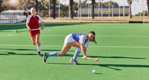 Hockey, sports and fitness with women on field and training for for workout, endurance and health.